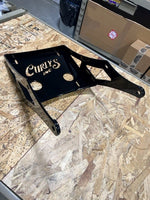 
              Curly’s Inc - TOUR PACK BRACKET – DIRECT BOLT ON
            